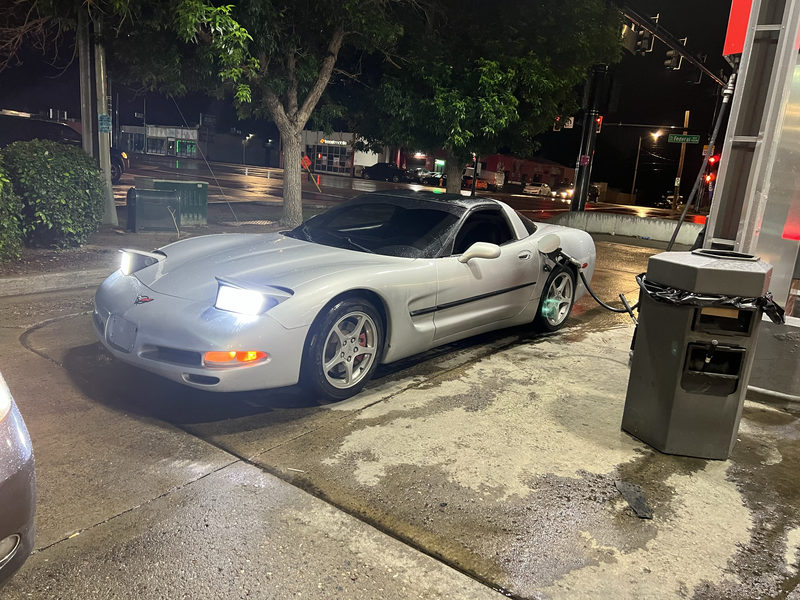 Silver Chevrolet Corvette at night